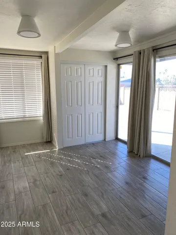 a view of an empty room with a window