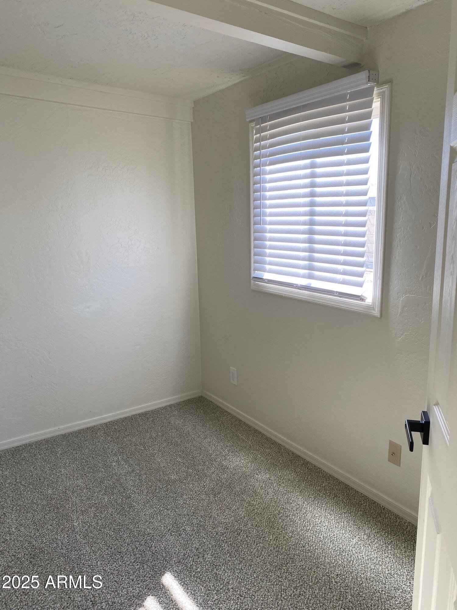 1821 West Libby Street Phoenix, AZ 85023 - Photo 18 of 26 a view of an empty room with a window