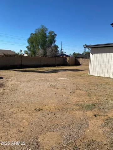 a view of a backyard of a house