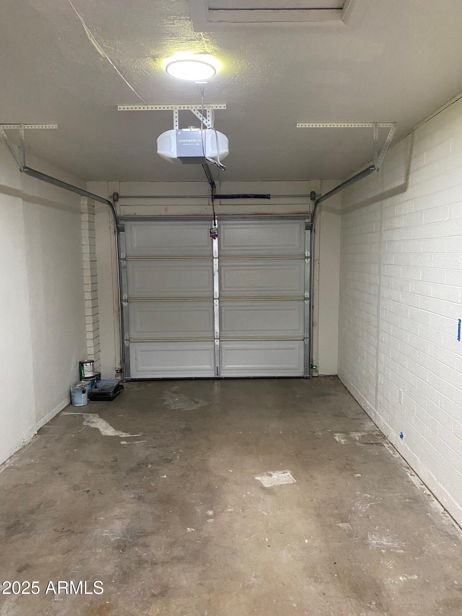 1821 West Libby Street Phoenix, AZ 85023 - Photo 5 of 26 an empty room with a cabinet and mirrors