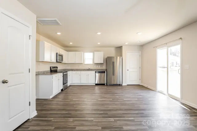 a view of kitchen with wooden floor