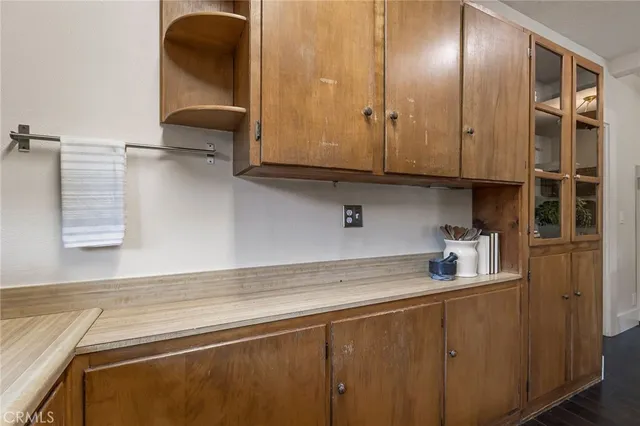 a kitchen with a sink and cabinets
