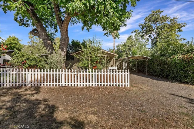 a view of a house with a small yard