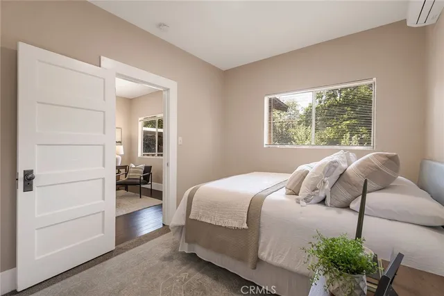 a bedroom with a bed and a window