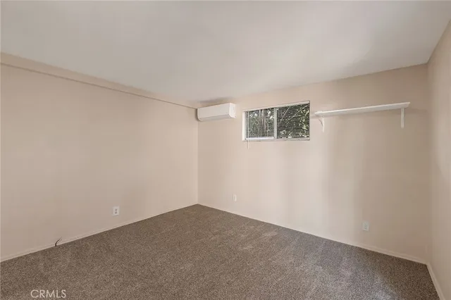 an empty room with a empty space and windows