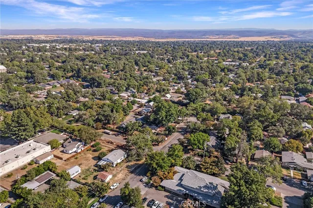 an aerial view of house with yard