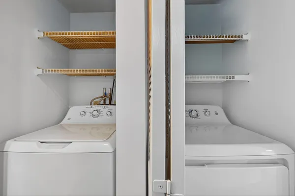 a utility room with dryer and washer