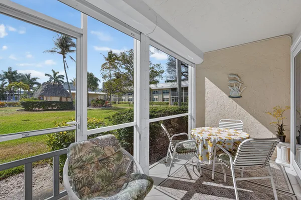 a patio with table and chairs