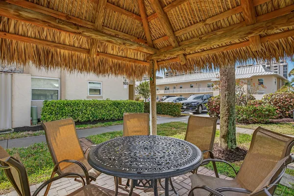 a view of a chairs and table in the patio