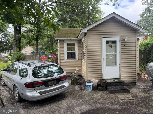 a car parked in front of a house