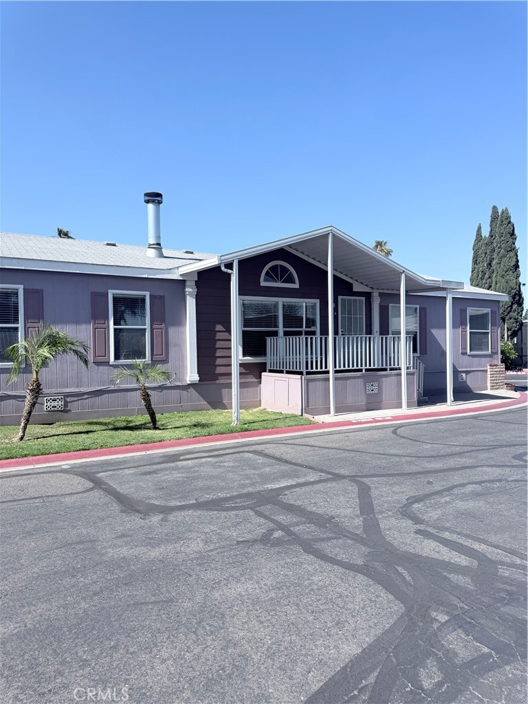 front view of a house with a swimming pool