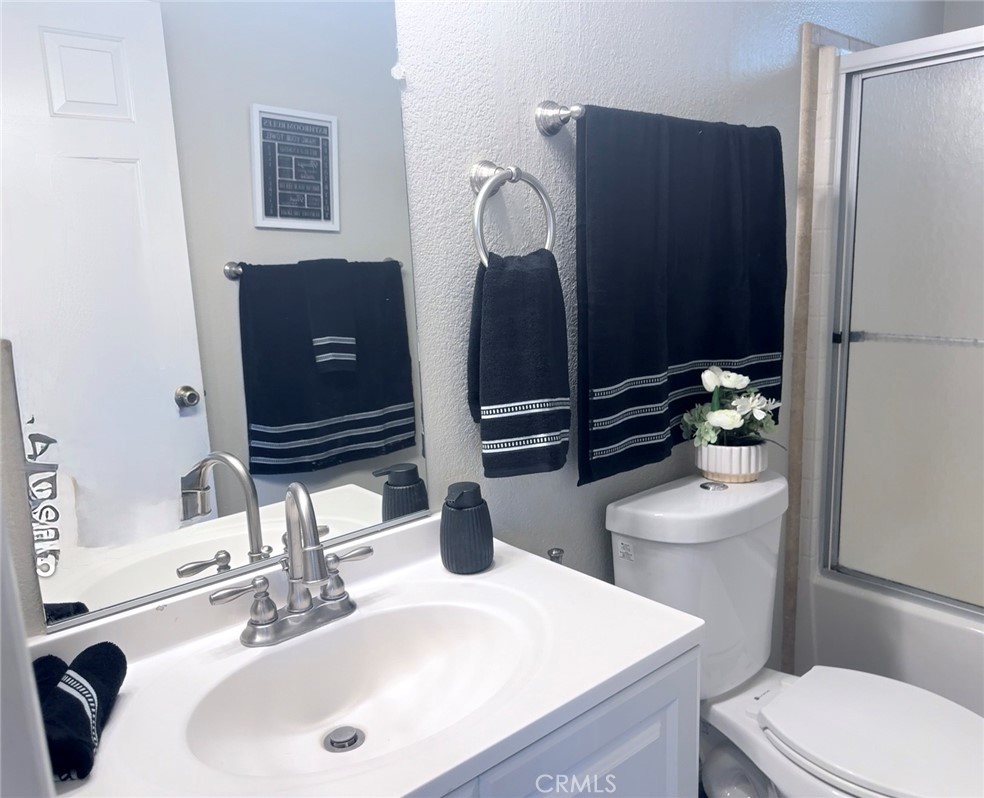 1855 Riverside, Unit 405 Ontario, CA 91761 - Photo 17 of 25 a bathroom with a sink and a toilet