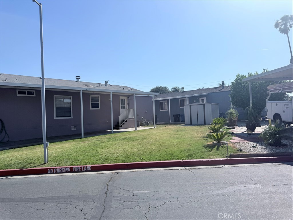 1855 Riverside, Unit 405 Ontario, CA 91761 - Photo 22 of 25 a view of a house with a backyard