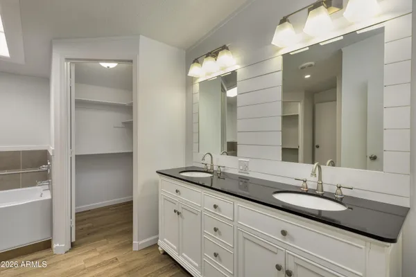 a bathroom with a shower a toilet and a sink