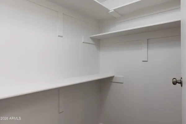 a bathroom with a granite countertop sink a toilet and a mirror