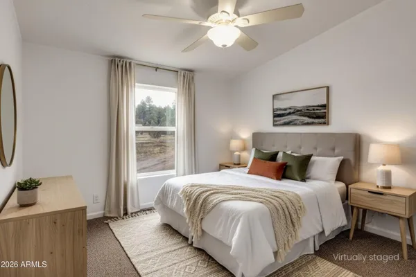 a kitchen with a dining table chairs refrigerator and cabinets