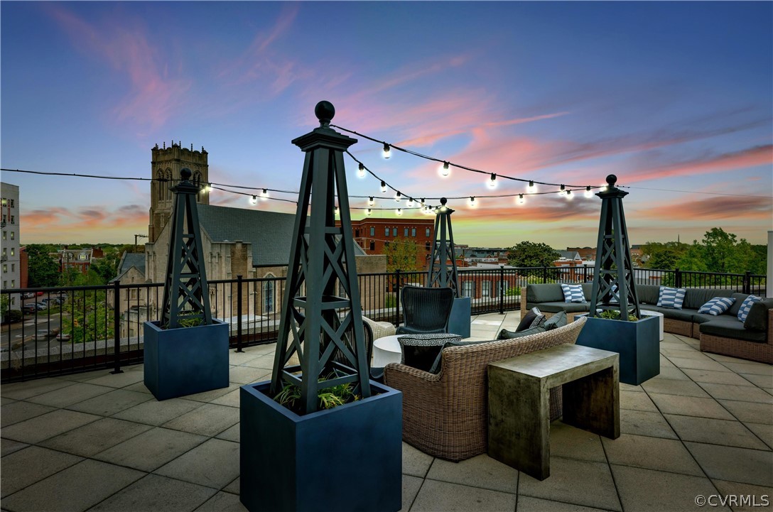 413 Stuart Circle, Unit U2D Richmond, VA 23220 - Photo 29 of 31 Partial view at dusk of rooftop terrance and stunn