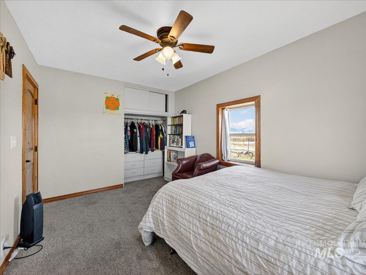 2588 West Sales Yard Road Emmett, ID 83617 - Photo 31 of 50 Carpeted bedroom featuring a closet and ceiling fan