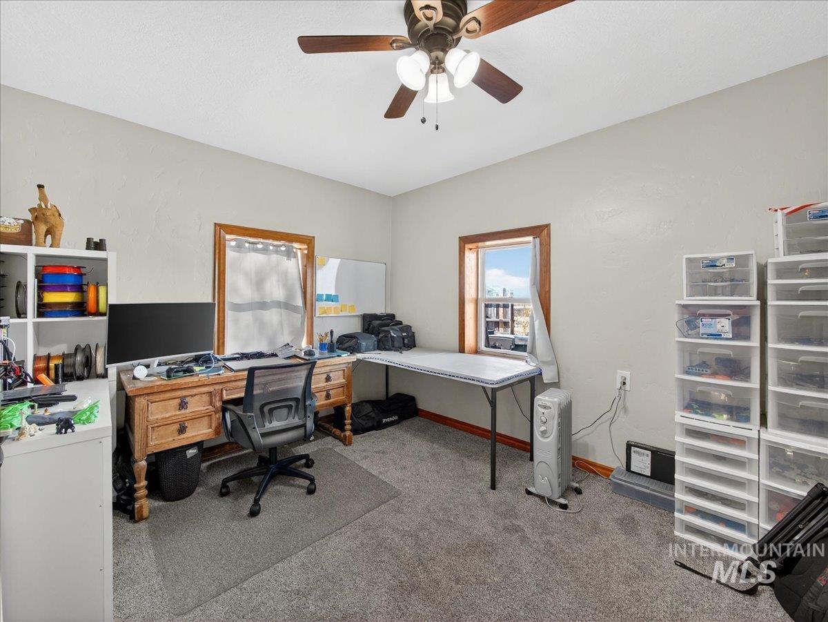 2588 West Sales Yard Road Emmett, ID 83617 - Photo 32 of 50 Office area with light carpet and a ceiling fan
