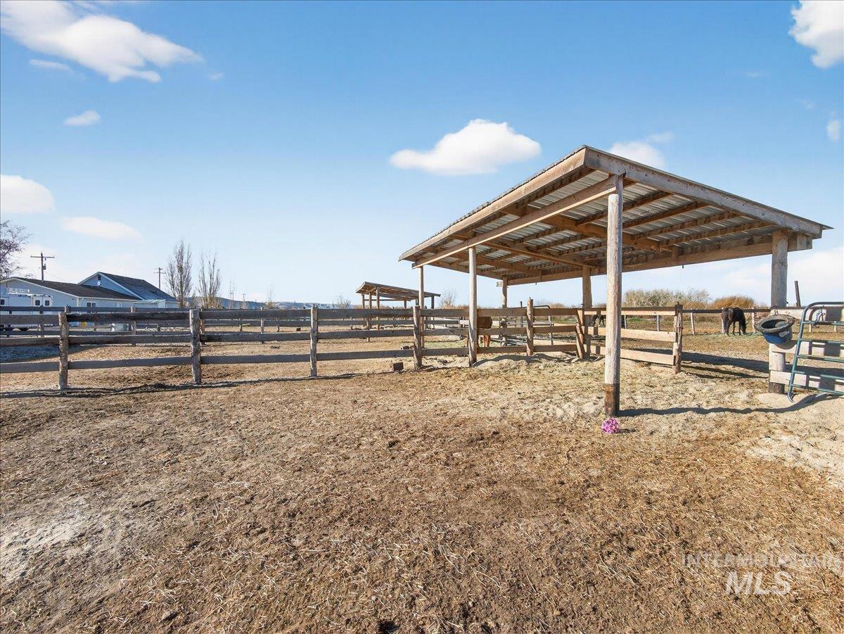 2588 West Sales Yard Road Emmett, ID 83617 - Photo 39 of 50 View of yard featuring a view of rural / pastoral area, an outbuilding, and an exterior structure