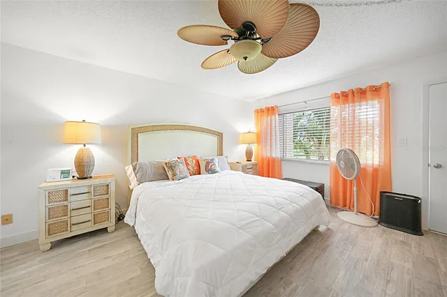 a bedroom with a bed and dresser