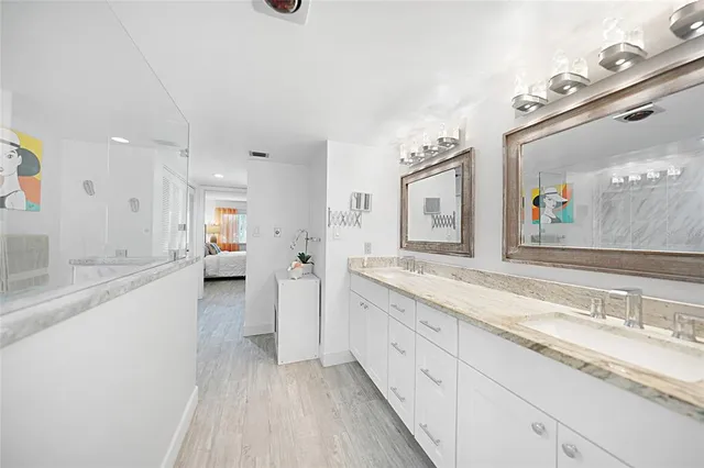 a bathroom with a shower curtain and a sink