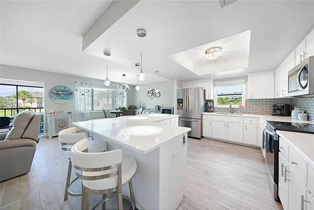 a living room with furniture a table and chairs