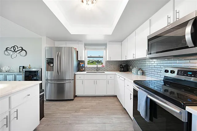 a kitchen with a sink counter top space and appliances