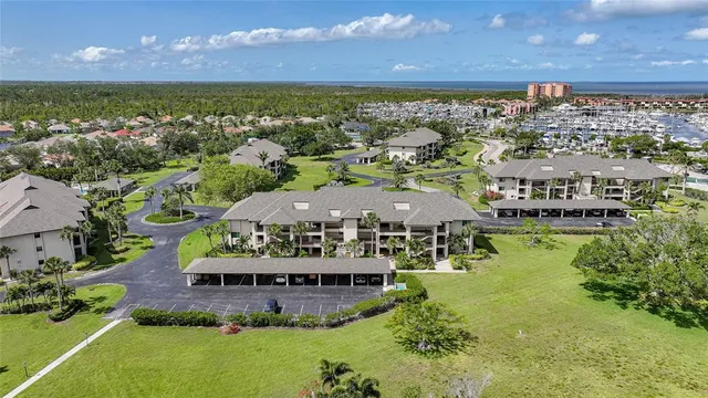 an aerial view of houses with a yard