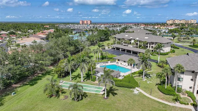 an aerial view of a house with garden space and street view