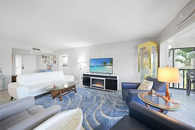 a bed room with a bed and a chandelier