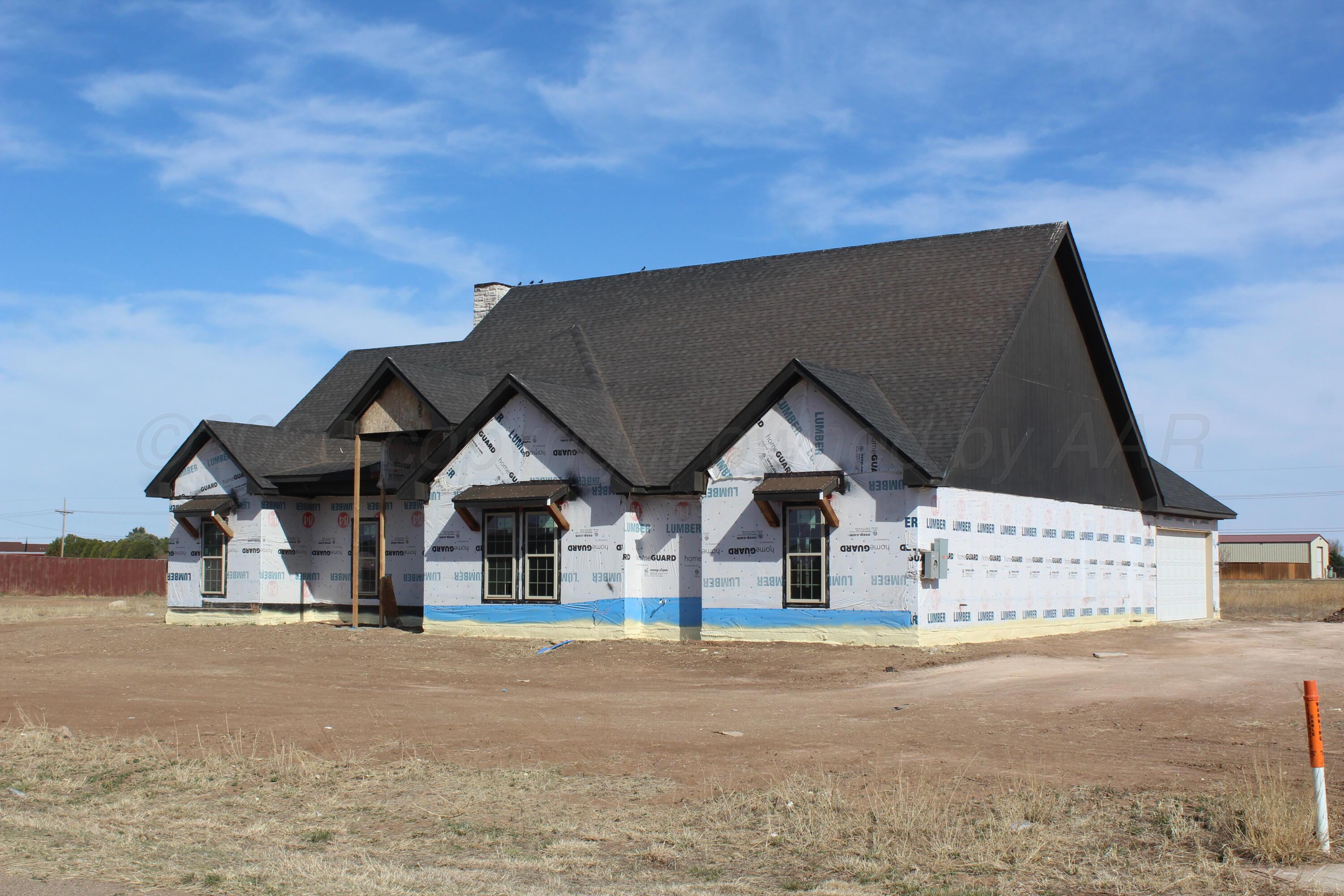8300 Matilda Lane Amarillo, TX 79119 - Photo 3 of 14 a front view of a house with a yard