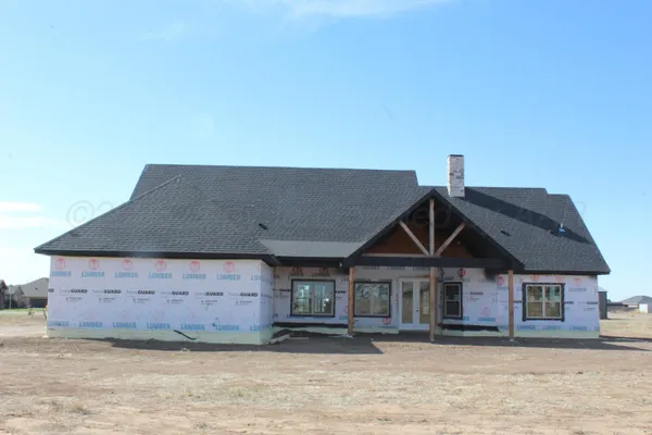 a front view of a house with a wooden floor