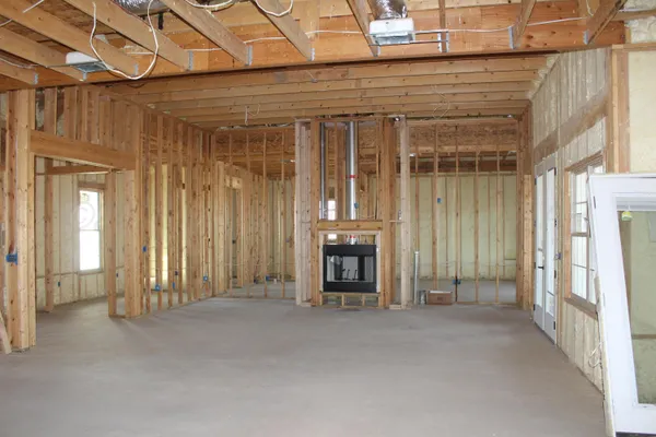 a view of an empty room with a fireplace