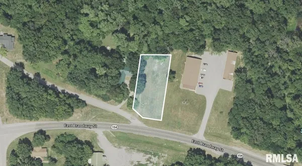an aerial view of a residential houses with outdoor space