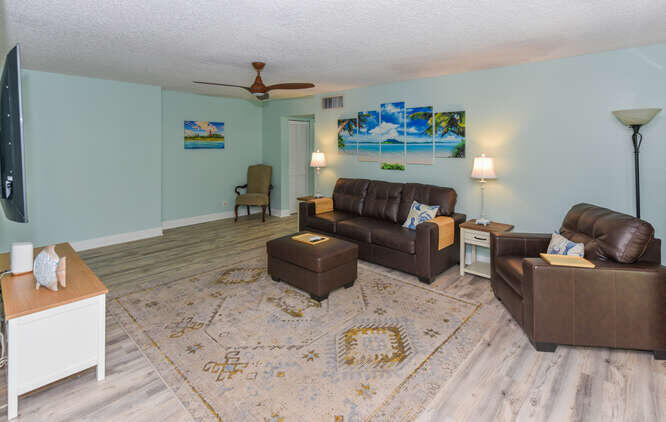 150 Pineview Road, Unit L6 Jupiter, FL 33469 - Photo 9 of 31 a living room with furniture and a couch