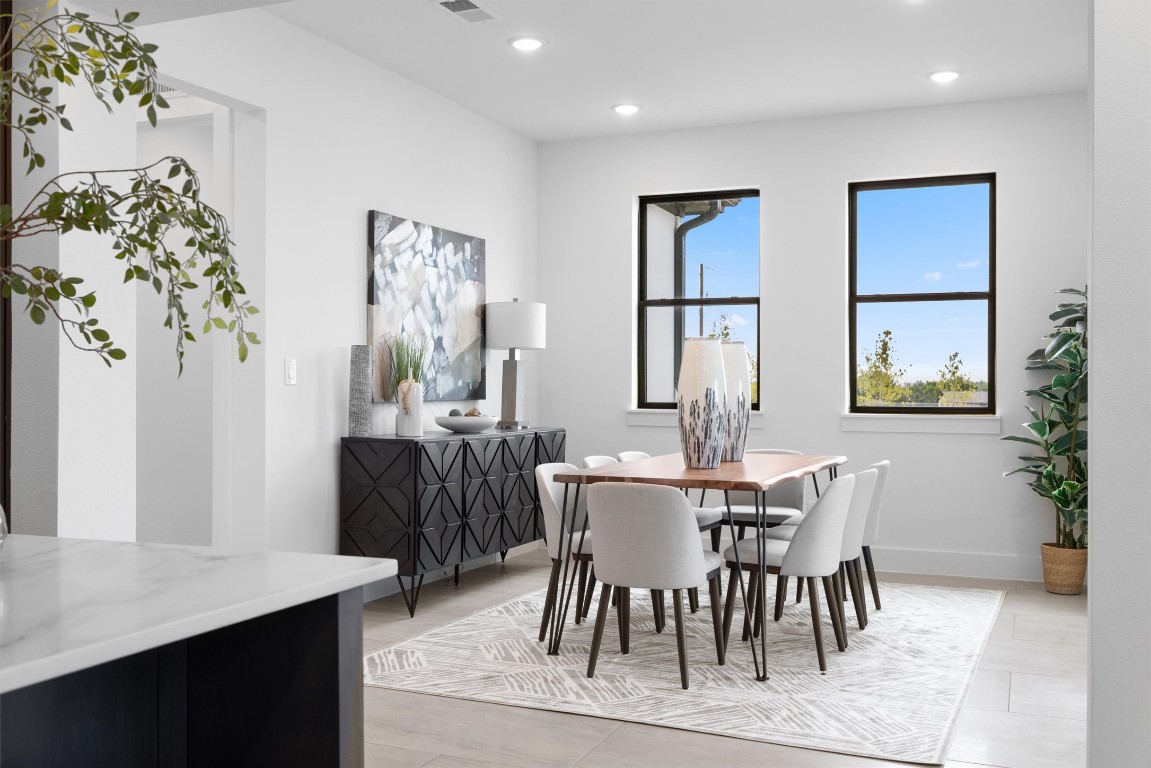 101 Fall Drive Georgetown, TX 78633 - Photo 13 of 40 a view of a dining room with furniture and chandelier