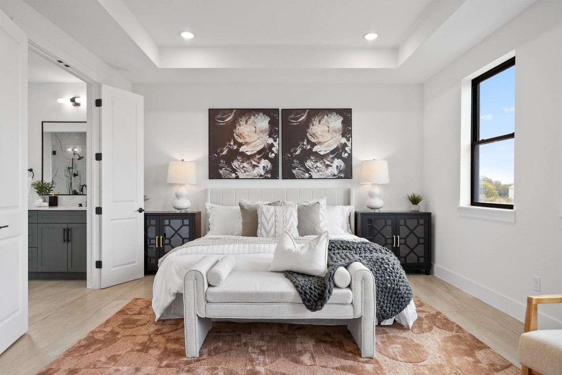 101 Fall Drive Georgetown, TX 78633 - Photo 17 of 40 a bedroom with a bed and glass windows