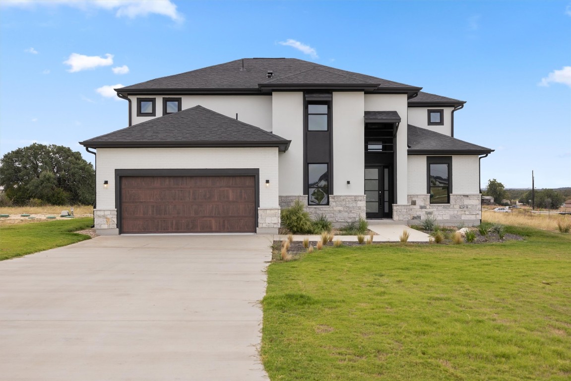 101 Fall Drive Georgetown, TX 78633 - Photo 2 of 40 a front view of a house with a yard