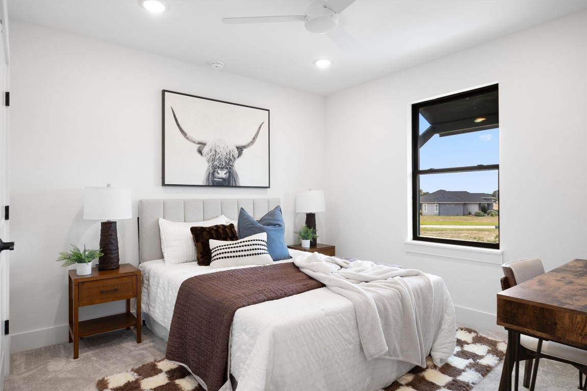 101 Fall Drive Georgetown, TX 78633 - Photo 26 of 40 a bedroom with a bed and a painting on the wall