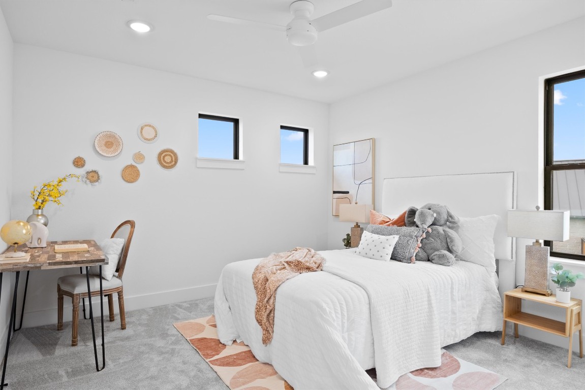 101 Fall Drive Georgetown, TX 78633 - Photo 30 of 40 a bedroom with a bed and a table in it