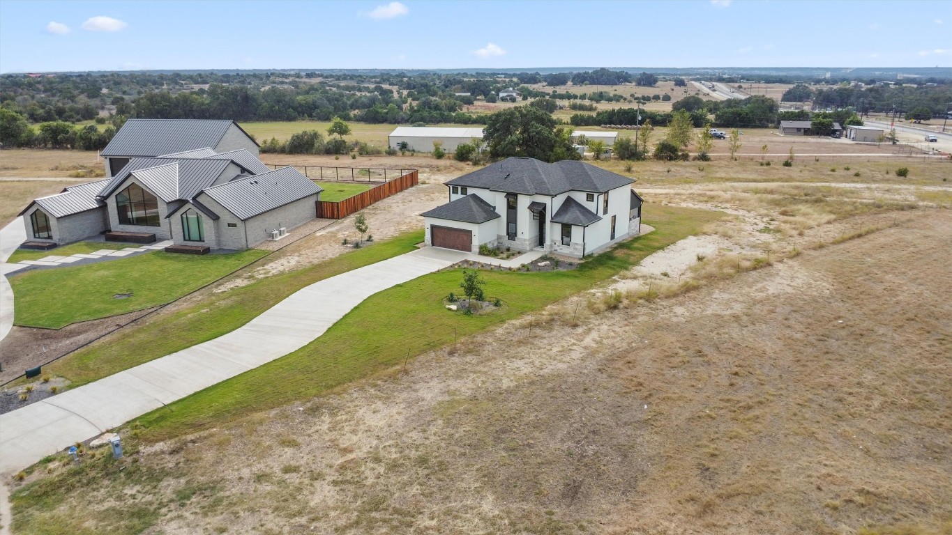 101 Fall Drive Georgetown, TX 78633 - Photo 38 of 40 an aerial view of a house with a garden and mountain view