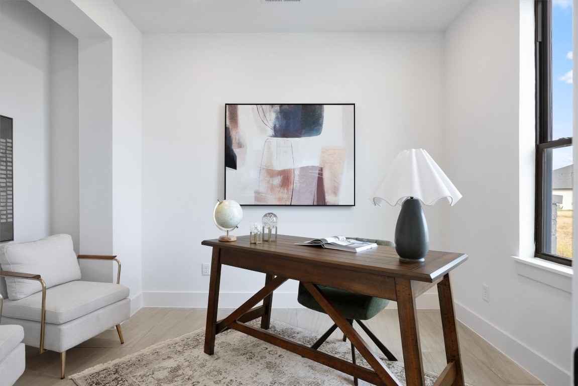 101 Fall Drive Georgetown, TX 78633 - Photo 4 of 40 a living room with furniture and a window