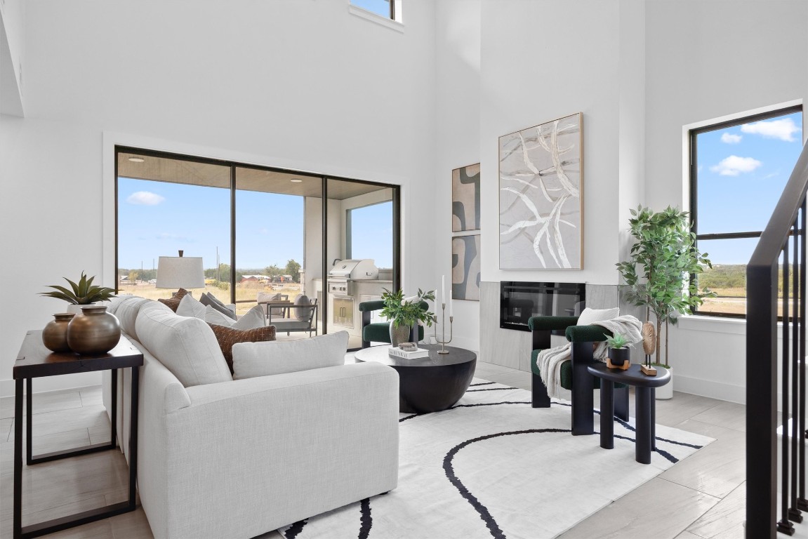 101 Fall Drive Georgetown, TX 78633 - Photo 7 of 40 a living room with furniture fireplace and a large window