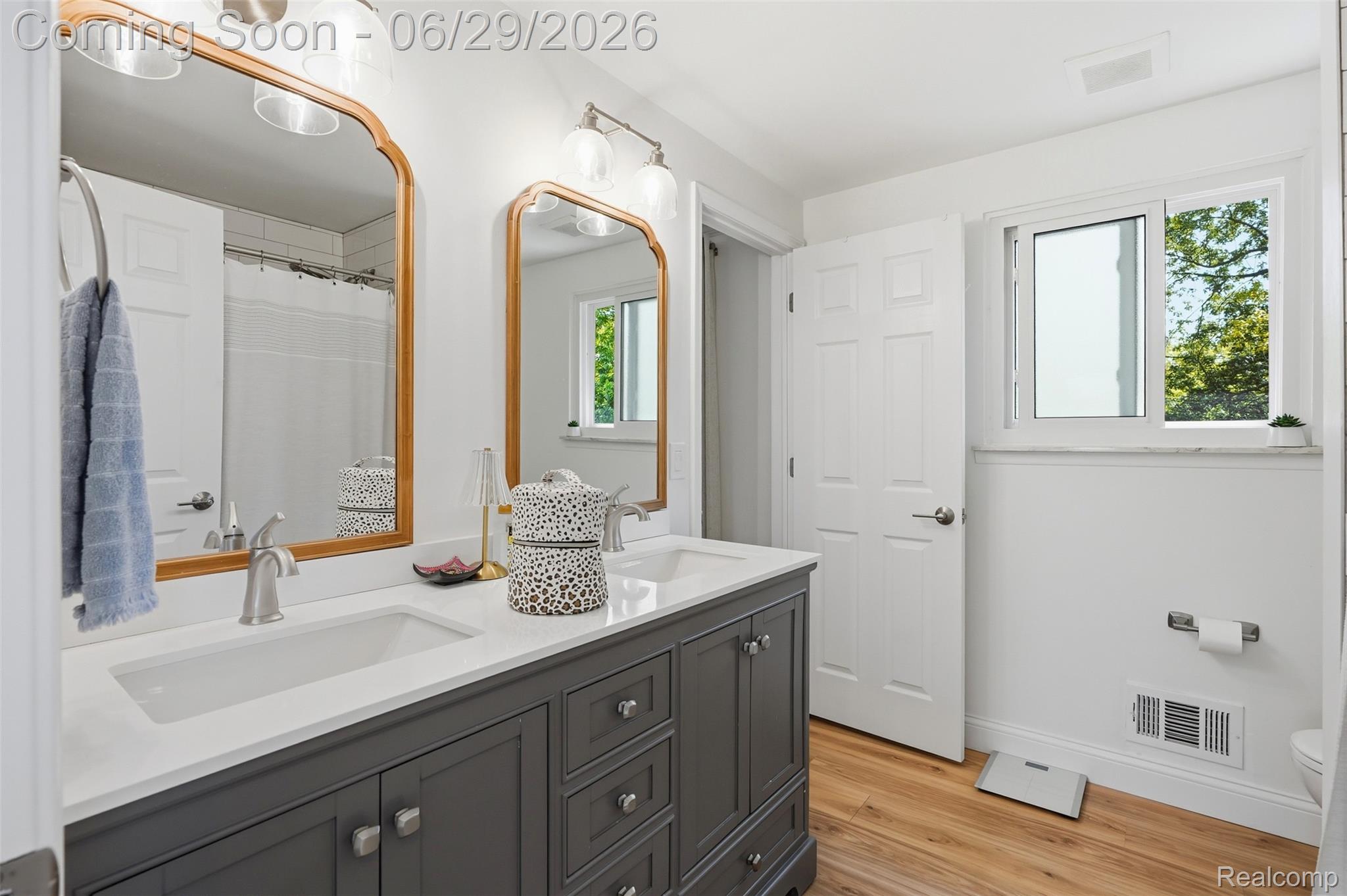 45179 Rudgate Road Canton, MI 48188 - Photo 16 of 48 Dual vanity with a white countertop and rectangular undermount sinks
