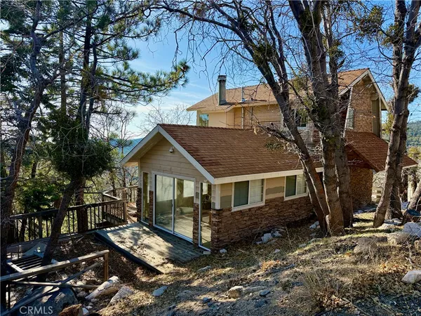 a view of house with a yard