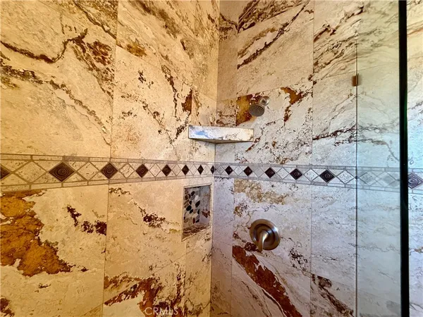 a bathroom with a toilet and shower