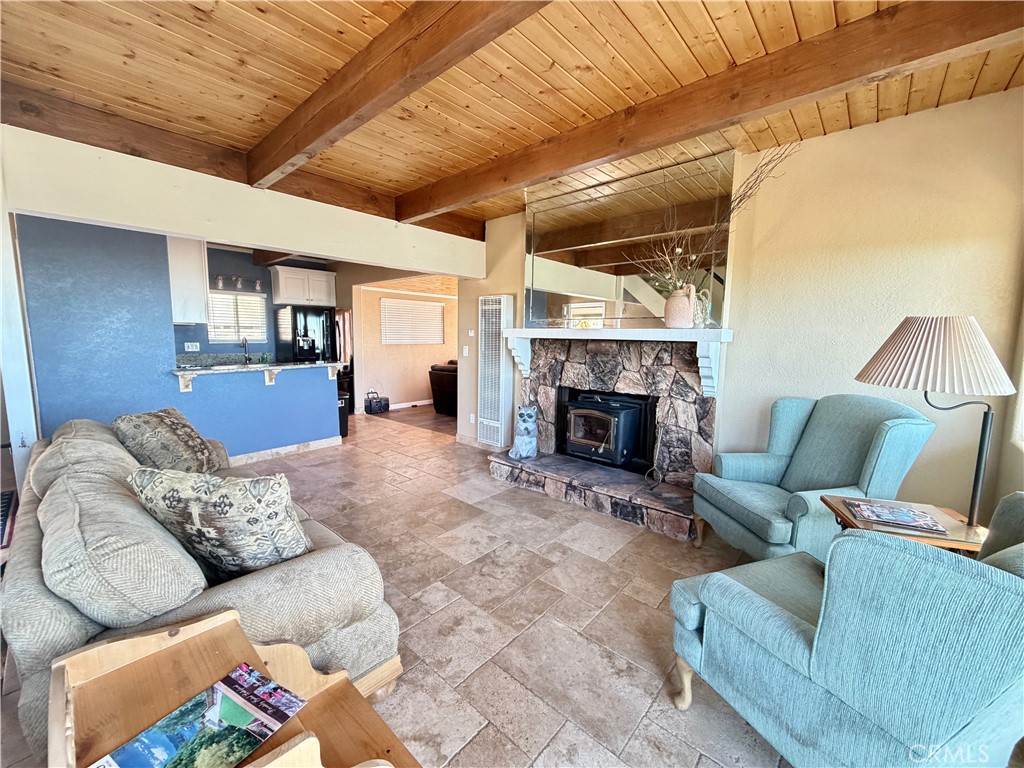 2190 Tank Running Springs Running Springs, CA 92382 - Photo 3 of 33 a living room with furniture and a fireplace
