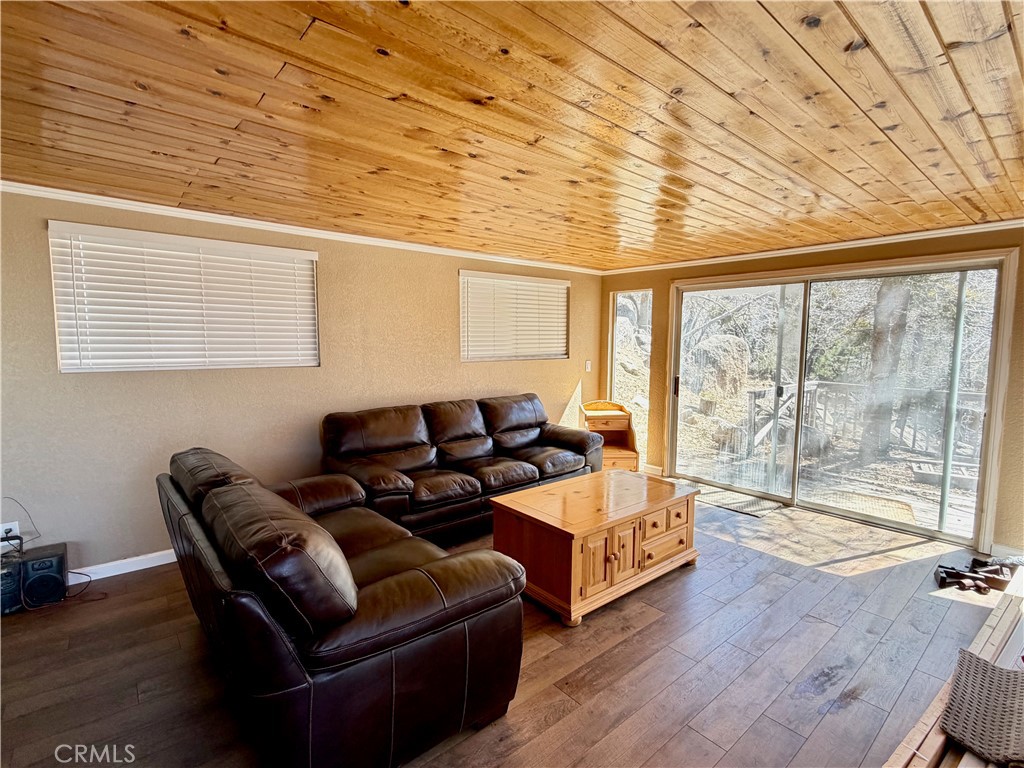 2190 Tank Running Springs Running Springs, CA 92382 - Photo 10 of 33 a living room with furniture and a large window
