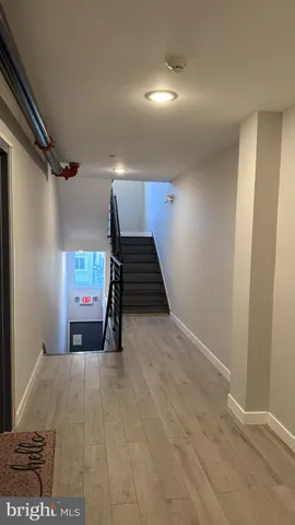 a view of a room with stairs and furniture